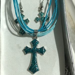 Teal cross necklace and earring set.